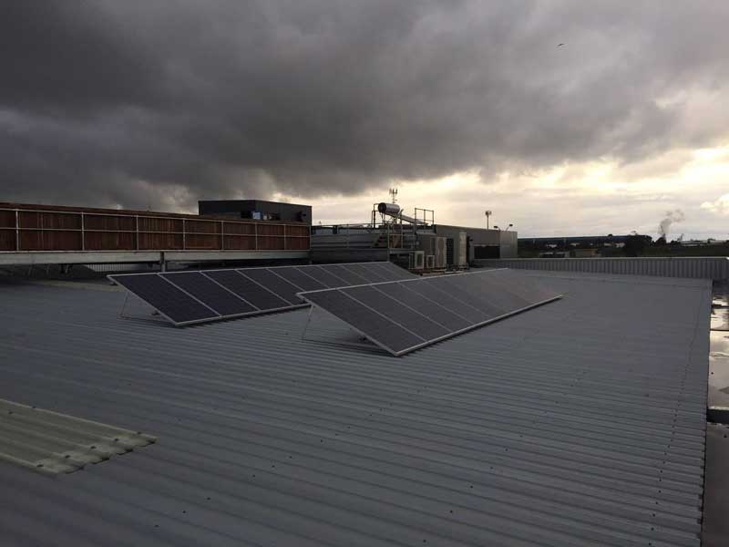 Commercial solar panels installed on tin roof