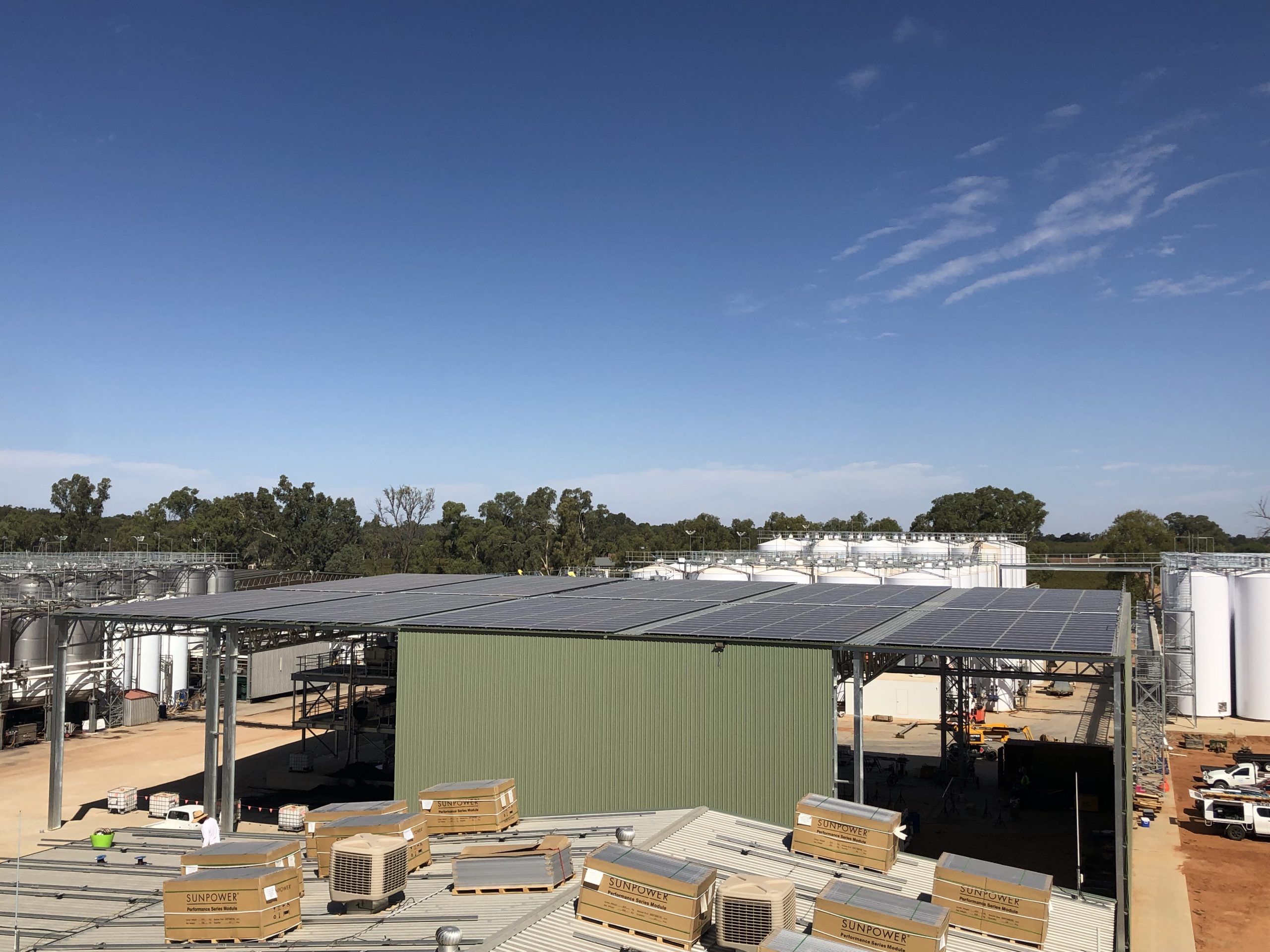 Commercial solar panels near large tanks